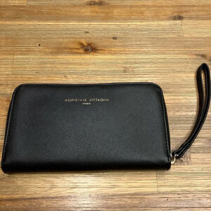 Adrienne Vittadini black wallet/ wristlet with built‎ in phone charger.